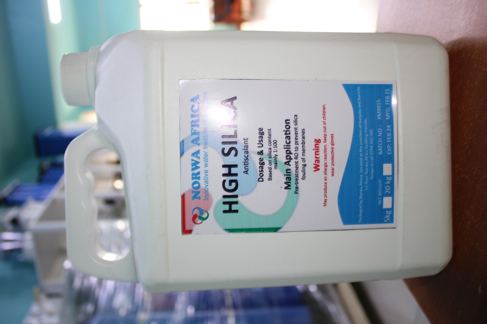 Chemical dosing pump on wall