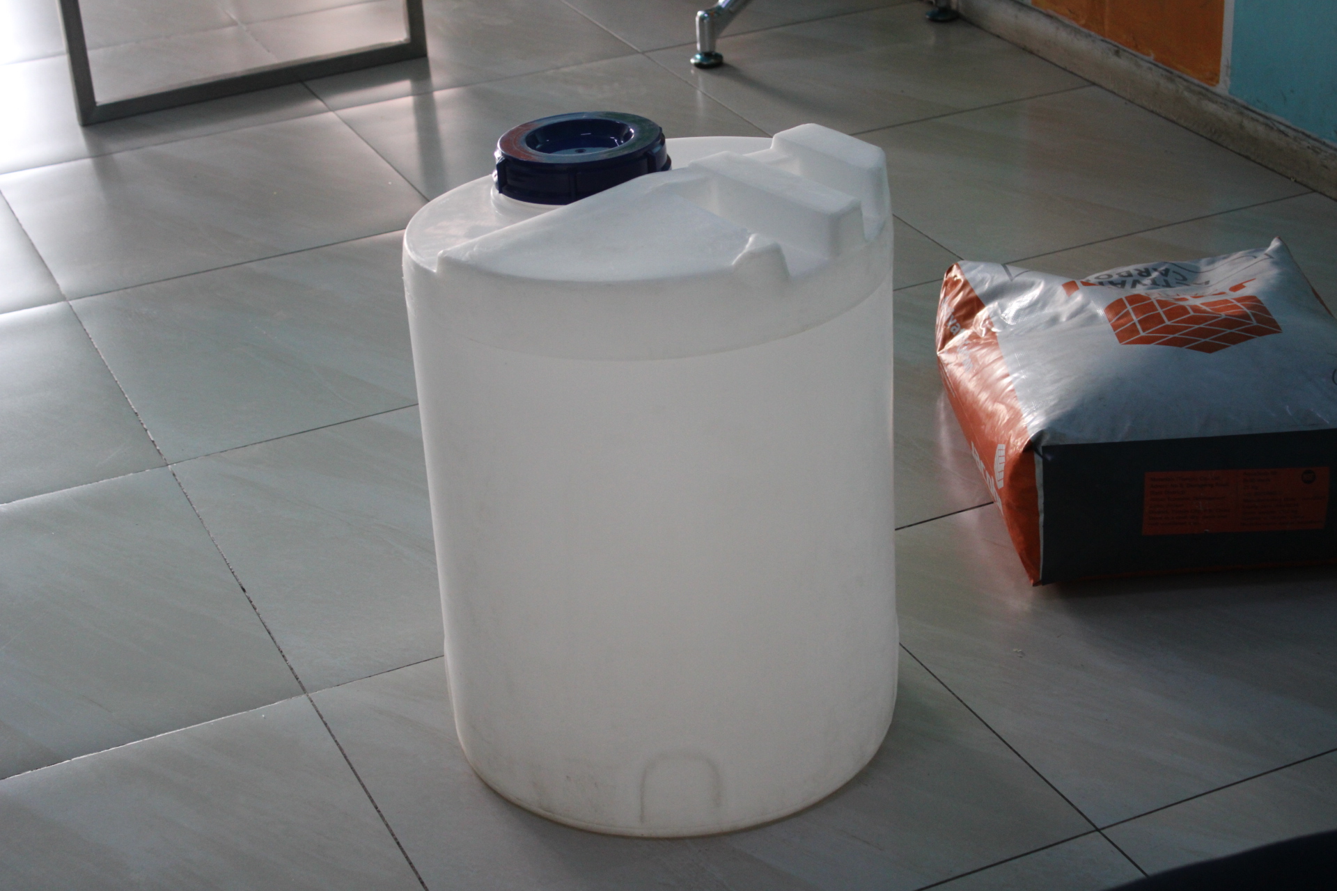 Technician cleaning brine tank